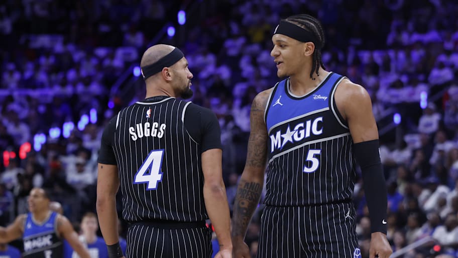 Orlando Magic guard Jalen Suggs and forward Paolo Banchero talk during a timeout against the Detroit Pistons.