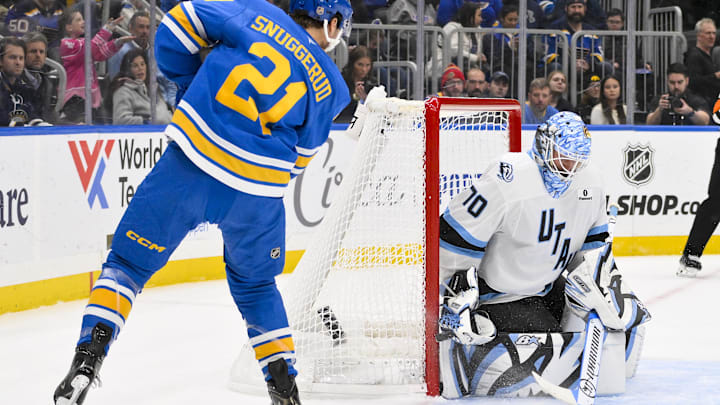 Oct 23, 2025; St. Louis, Missouri, USA; Utah Mammoth goaltender Karel Vejmelka (70) defends the net against a shot by St. Louis Blues right wing Jimmy Snuggerud (21) during the second period at Enterprise Center. Mandatory Credit: Jeff Curry-Imagn Images