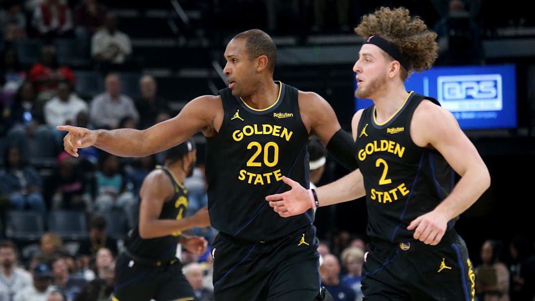 Feb 25, 2026; Memphis, Tennessee, USA; Golden State Warriors center Al Horford (20) and guard Brandin Podziemski (2) get back on defense during the second quarter against the Memphis Grizzlies at FedExForum. Mandatory Credit: Petre Thomas-Imagn Images