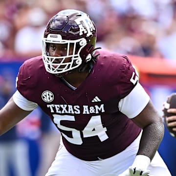 Sep 23, 2023; College Station, Texas, USA; Texas A&M Aggies offensive lineman Mark Nabou Jr. (54) in action during the first half against the Auburn Tigers at Kyle Field. Mandatory Credit: Maria Lysaker-Imagn Images