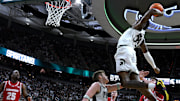 Michigan State Spartans forward Coen Carr (55) goes up for a dunk 