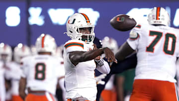 Oct 5, 2024; Berkeley, California, USA; Miami Hurricanes quarterback Cam Ward (1) throws a pass against the California Golden Bears during the first quarter at California Memorial Stadium. Mandatory Credit: Darren Yamashita-Imagn Images
