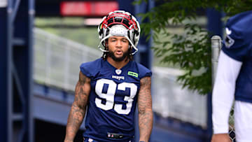 Jul 24, 2024; Foxborough, MA, USA; New England Patriots linebacker Oshane Ximines (93) walks to the practice field during training camp at Gillette Stadium. Mandatory Credit: Eric Canha-Imagn Images