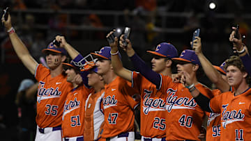 Clemson Tigers hold up their phone lights Thursday, Oct. 23, 2025, during the exhibition baseball game against the Savannah Bananas at Doug Kingsmore Stadium in Clemson, South Carolina.