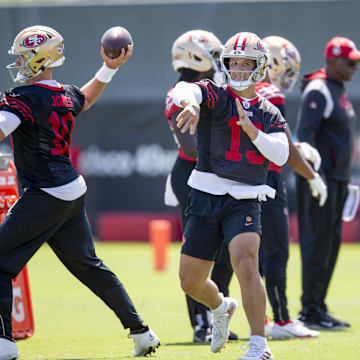 Jun 11, 2025; Santa Clara, CA, USA; San Francisco 49ers quarterbacks Mac Jones (10) and Brock Purdy (13) work on passing drills during a team OTA at Levi's Stadium. Mandatory Credit: D. Ross Cameron-Imagn Images