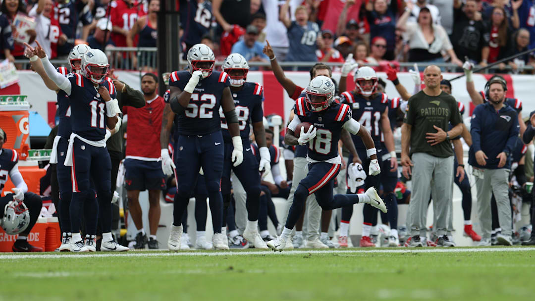 Nov 9, 2025; Tampa, Florida, USA; New England Patriots wide receiver Kyle Williams (18) runs for a touchdown during the second quarter against the Tampa Bay Buccaneers at Raymond James Stadium. Mandatory Credit: Nathan Ray Seebeck-Imagn Images