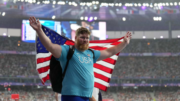 Aug 3, 2024; Paris, FRANCE; Ryan Crouser (USA) celebrates winning the gold medal in the men's shot put during the Paris 2024 Olympic Summer Games at Stade de France. Mandatory Credit: James Lang-USA TODAY Sports