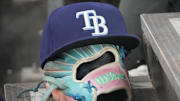 Sep 26, 2025; Toronto, Ontario, CAN; The hat and glove of Tampa Bay Rays third baseman Junior Caminero (13) in the dugout during the game against the Toronto Blue Jays at Rogers Centre. 