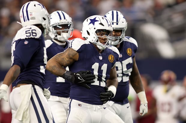 Dallas Cowboys LB Micah Parsons celebrates a sack of Washington Commanders quarterback Sam Howell.