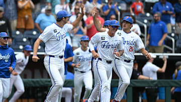 Jun 19, 2024; Omaha, NE, USA;  The Florida Gators bench celebrate the win against the Kentucky Wildcats at Charles Schwab Field Omaha. Mandatory Credit: Steven Branscombe-Imagn Images
