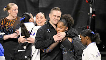 Apr 17, 2025; Fort Worth, TX, USA; The University of Florida Gator team reacts after the announcement of the final team scores during the 2025 Women's National Gymnastics Semifinal at Dickies Arena. Mandatory Credit: Jerome Miron-Imagn Images