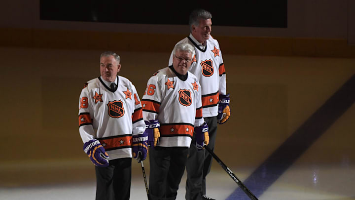 Oct 14, 2016; Los Angeles, CA, USA; Los Angeles Kings former players Dave Taylor (left), Marcel Dionne (center) and Charlie Simmer are introduced during a NHL game against the Philadelphia Flyers at Staples Center. Mandatory Credit: Kirby Lee-Imagn Images