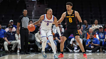 Dec 14, 2024; Atlanta, Georgia, USA; Florida Gators guard Will Richard (5) controls the ball against Arizona State Sun Devils forward Basheer Jihad (8) during the second half at State Farm Arena. Mandatory Credit: Jordan Godfree-Imagn Images