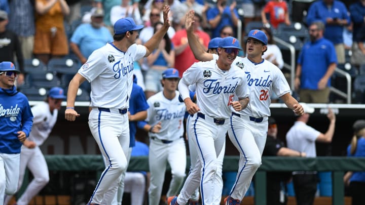 The Florida Gators bench celebrate the win against the Kentucky Wildcats at Charles Schwab Field Omaha. 