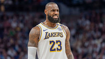 Apr 27, 2025; Minneapolis, Minnesota, USA; Los Angeles Lakers forward LeBron James (23) talks with a referee in the third quarter against the Minnesota Timberwolves during game four of first round for the 2025 NBA Playoffs at Target Center. Mandatory Credit: Matt Blewett-Imagn Images