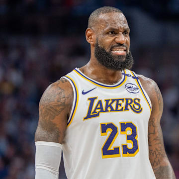 Apr 27, 2025; Minneapolis, Minnesota, USA; Los Angeles Lakers forward LeBron James (23) talks with a referee in the third quarter against the Minnesota Timberwolves during game four of first round for the 2025 NBA Playoffs at Target Center. Mandatory Credit: Matt Blewett-Imagn Images