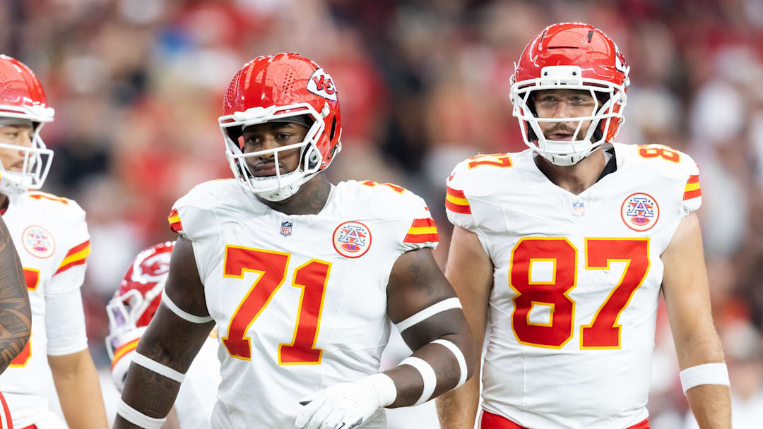 Aug 9, 2025; Glendale, Arizona, USA; Kansas City Chiefs offensive tackle Josh Simmons (71) and tight end Travis Kelce (87) against the Arizona Cardinals during a preseason NFL game at State Farm Stadium. Mandatory Credit: Mark J. Rebilas-Imagn Images