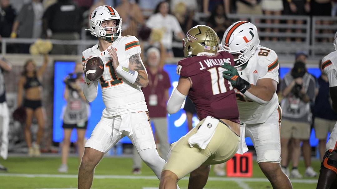 Oct 4, 2025; Tallahassee, Florida, USA; Miami Hurricanes quarterback Carson Beck (11) throws during the first half against the Florida State Seminoles at Doak S. Campbell Stadium. Mandatory Credit: Melina Myers-Imagn Images