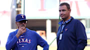 Texas Rangers pitching coach Mike Maddux (31) talks with general manager Chris Young (right) prior to a game against the Los Angeles Angels at Angel Stadium.