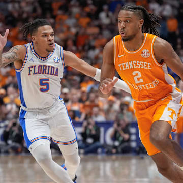 Tennessee guard Chaz Lanier (2) drives up court past Florida guard Will Richard (5) during the first half of the Southeastern Conference tournament championship at Bridgestone Arena in Nashville, Tenn., Sunday, March 16, 2025.