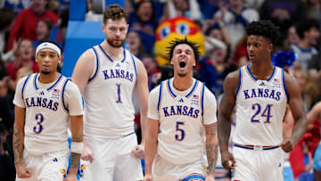 Zeke Mayo #5 of the Kansas Jayhawks celebrates a basket against the West Virginia Mountaineers in the second half at Allen Fieldhouse on December 31, 2024 in Lawrence, Kansas.
