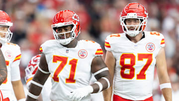 Aug 9, 2025; Glendale, Arizona, USA; Kansas City Chiefs offensive tackle Josh Simmons (71) and tight end Travis Kelce (87) against the Arizona Cardinals during a preseason NFL game at State Farm Stadium. Mandatory Credit: Mark J. Rebilas-Imagn Images