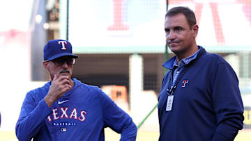 Sep 28, 2024; Anaheim, California, USA;  Texas Rangers pitching coach Mike Maddux (31) talks with general manager Chris Young (right) prior to a game against the Los Angeles Angels at Angel Stadium.