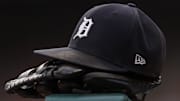 Jul 30, 2021; Detroit, Michigan, USA; The hat and glove of Detroit Tigers right fielder Robbie Grossman (8) sits on the ledge of the dugout during the first inning against the Baltimore Orioles at Comerica Park. 