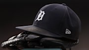 Jul 30, 2021; Detroit, Michigan, USA; The hat and glove of Detroit Tigers right fielder Robbie Grossman (8) sits on the ledge of the dugout during the first inning against the Baltimore Orioles at Comerica Park. 