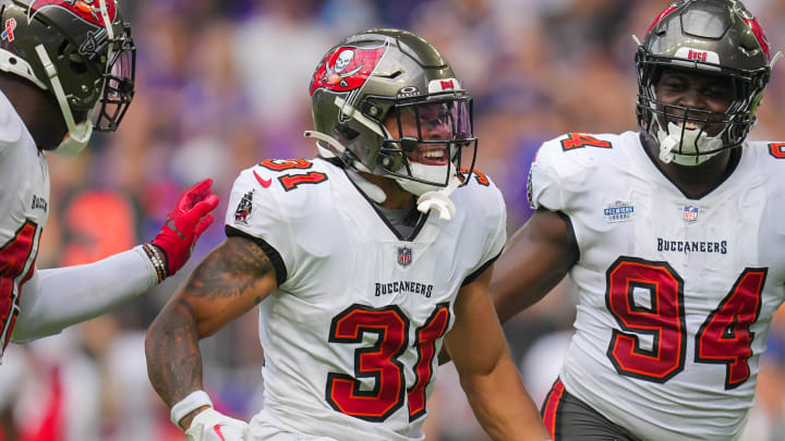 Sep 10, 2023; Minneapolis, Minnesota, USA; Tampa Bay Buccaneers safety Antoine Winfield Jr. (31) celebrates his fumble recovery with defensive tackle Calijah Kancey (94) against the Minnesota Vikings in the first quarter at U.S. Bank Stadium. Mandatory Credit: Brad Rempel-USA TODAY Sports