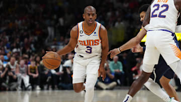 Phoenix Suns guard Chris Paul controls the ball in the first quarter against the Denver Nuggets