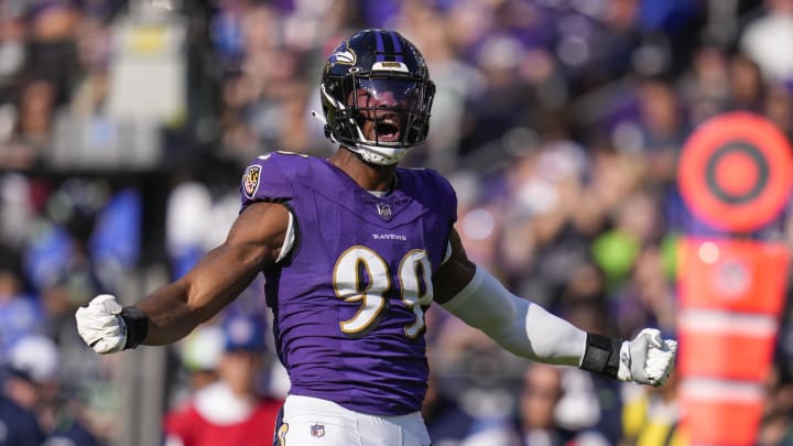 Nov 5, 2023; Baltimore, Maryland, USA;  Baltimore Ravens linebacker Odafe Oweh (99) celebrates after making a defensive play against the Seattle Seahawks during the first half at M&T Bank Stadium. Mandatory Credit: Jessica Rapfogel-USA TODAY Sports