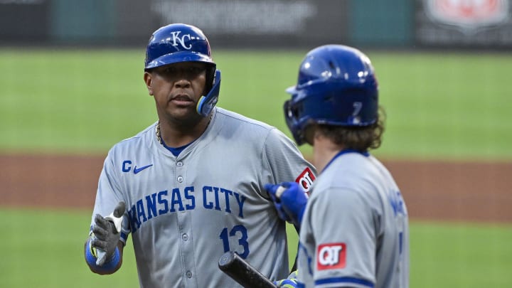 Jul 10, 2024; St. Louis, Missouri, USA;  Kansas City Royals designated hitter Salvador Perez (13) is congratulated by shortstop Bobby Witt Jr. (7) after hitting a sacrifice fly against the St. Louis Cardinals during the fourth inning at Busch Stadium.