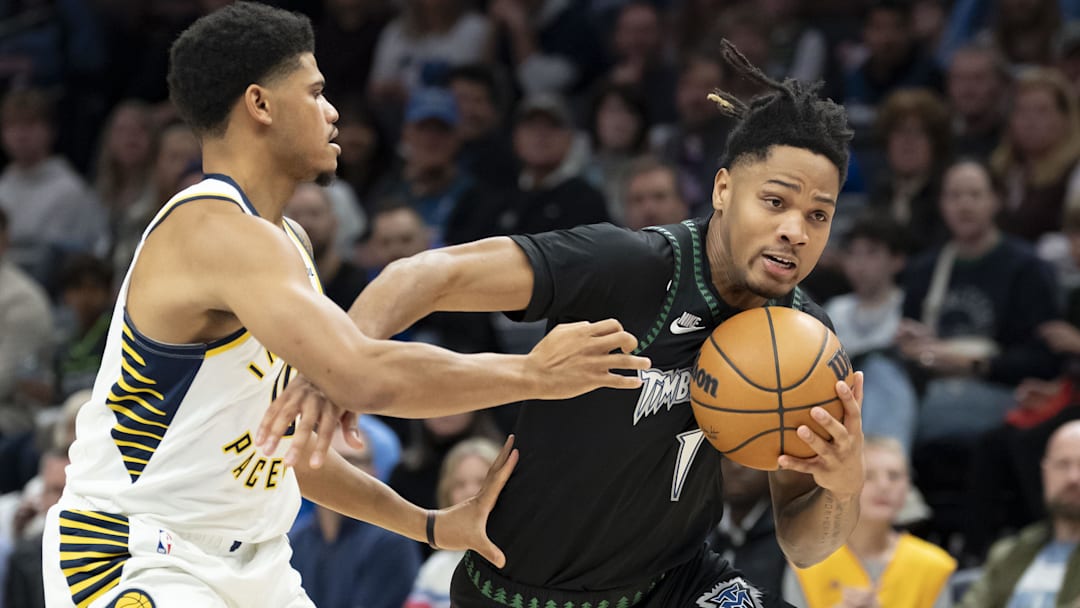 Oct 26, 2025; Minneapolis, Minnesota, USA; Minnesota Timberwolves guard Terrence Shannon Jr. (1) drives to the basket past Indiana Pacers guard RayJ Dennis (10) in the first half at Target Center.