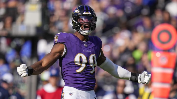 Nov 5, 2023; Baltimore, Maryland, USA;  Baltimore Ravens linebacker Odafe Oweh (99) celebrates after making a defensive play against the Seattle Seahawks during the first half at M&T Bank Stadium. Mandatory Credit: Jessica Rapfogel-USA TODAY Sports