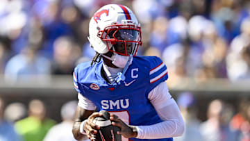 Oct 4, 2025; Dallas, Texas, USA; SMU Mustangs quarterback Kevin Jennings (7) drops back to pass the ball during the first half against the Syracuse Orange at Gerald J. Ford Stadium. Mandatory Credit: Jerome Miron-Imagn Images