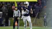 Nov 8, 2025; Charlottesville, Virginia, USA; Virginia Cavaliers quarterback Daniel Kaelin (10) runs with the ball against the Wake Forest Demon Deacons during the first half at Scott Stadium. Mandatory Credit: Amber Searls-Imagn Images