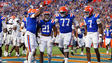 Oct 18, 2025; Gainesville, Florida, USA; Florida Gators running back KD Daniels (21) celebrates with Florida Gators quarterback DJ Lagway (2) after scoring a touchdown against the Mississippi State Bulldogs during the second half at Ben Hill Griffin Stadium. Mandatory Credit: Matt Pendleton-Imagn Images