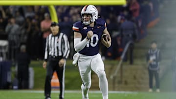 Nov 8, 2025; Charlottesville, Virginia, USA; Virginia Cavaliers quarterback Daniel Kaelin (10) runs with the ball against the Wake Forest Demon Deacons during the first half at Scott Stadium. Mandatory Credit: Amber Searls-Imagn Images