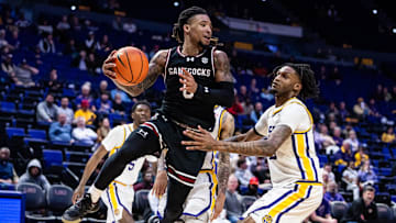 Feb 18, 2025; Baton Rouge, Louisiana, USA;  South Carolina Gamecocks guard Jamarii Thomas (6) drives to the basket against LSU Tigers forward Daimion Collins (10) during the second half at Pete Maravich Assembly Center. Mandatory Credit: Stephen Lew-Imagn Images