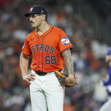 Apr 12, 2024; Houston, Texas, USA; Houston Astros starting pitcher J.P. France (68) reacts and Texas Rangers catcher Jonah Heim (28) rounds the bases after hitting a home run during the third inning at Minute Maid Park