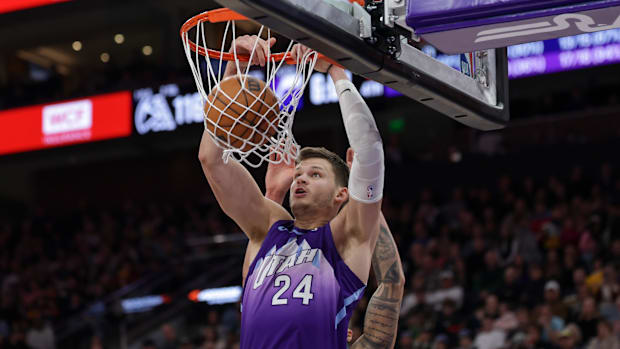 Utah Jazz center Walker Kessler (24) dunks the ball during the second half against the Denver Nuggets at Delta Center.