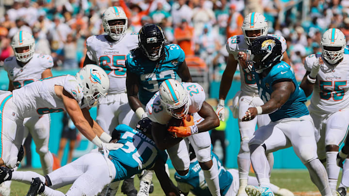 Miami Dolphins running back Jeff Wilson Jr. (23) runs with the football against the Jacksonville Jaguars during the fourth quarter at Hard Rock Stadium.