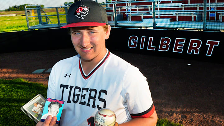 Member of the Gilbert baseball team Gabe Nelson shows former MLB player Bob Feller memorabilia at the Gilbert Baseball Field earlier this spring in Gilbert, Iowa. Member of the Gilbert baseball team Gabe Nelson shows former MLB player Bob Feller memorabilia at the Gilbert Baseball Field earlier this spring in Gilbert, Iowa.
