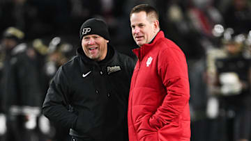Nov 28, 2025; West Lafayette, Indiana, USA;  Purdue Boilermakers head coach Barry Odom and Indiana Hoosiers head coach Curt Cignetti speak before the game at Ross-Ade Stadium. Mandatory Credit: Marc Lebryk-Imagn Images