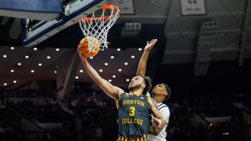 Boston College guard Jaeden Zackery (3) goes up for a shot as Notre Dame forward Tae Davis (13) defends during the Boston College-Notre Dame NCAA Men   s basketball game on Saturday, January 27, 2024, at Purcell Pavilion in South Bend, Indiana.