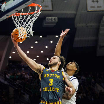 Boston College guard Jaeden Zackery (3) goes up for a shot as Notre Dame forward Tae Davis (13) defends during the Boston College-Notre Dame NCAA Men   s basketball game on Saturday, January 27, 2024, at Purcell Pavilion in South Bend, Indiana.