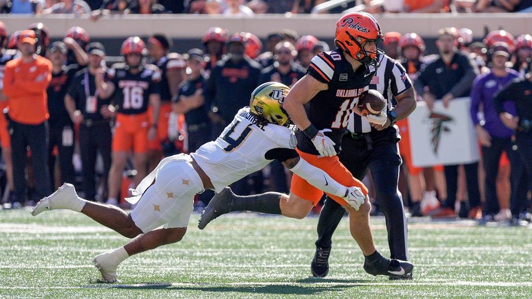 OSU wide receiver Wyatt Young (10) runs the ball and is taken down by UCF defensive back Braeden Marshall (4) in the first quarter during an NCAA football game between the Oklahoma State University (OSU) Cowboys and the University of Central Florida (UCF) Knights at Boone Pickens Stadium in Stillwater, Okla., on Saturday, Oct. 10, 2026. OSU wide receiver Wyatt Young (10) runs the ball and is taken down by UCF defensive back Braeden Marshall (4) in the first quarter during an NCAA football game between the Oklahoma State University (OSU) Cowboys and the University of Central Florida (UCF) Knights at Boone Pickens Stadium in Stillwater, Okla., on Saturday, Oct. 10, 2026.