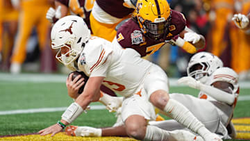 Jan 1, 2025; Atlanta, GA, USA; Texas Longhorns quarterback Quinn Ewers (3) recovers a fumble and is downed by Arizona State Sun Devils defensive back Shamari Simmons (7) for a safety during the second half of the Peach Bowl at Mercedes-Benz Stadium. Mandatory Credit: Dale Zanine-Imagn Images