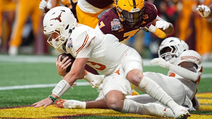 Jan 1, 2025; Atlanta, GA, USA; Texas Longhorns quarterback Quinn Ewers (3) recovers a fumble and is downed by Arizona State Sun Devils defensive back Shamari Simmons (7) for a safety during the second half of the Peach Bowl at Mercedes-Benz Stadium. Mandatory Credit: Dale Zanine-Imagn Images
